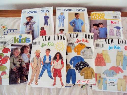 Collection of children's sewing patterns (some cut, some not) Winning bid gets all
