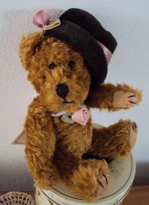 My name is PRECIOUS, I'm fully jointed with velvet hat and rose trims - pre-loved VGC