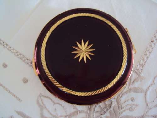 Vintage powder compact brown with gold tone accent, mirror intact.  UNUSED VGC