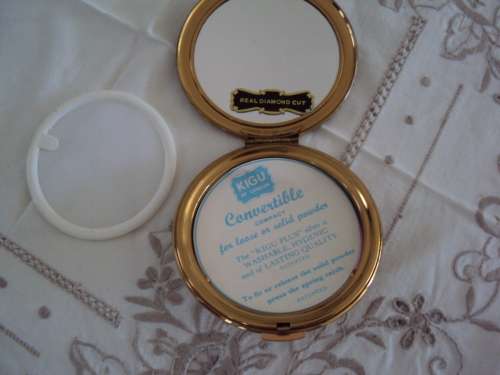Vintage powder compact brown with gold tone accent, mirror intact.  UNUSED VGC