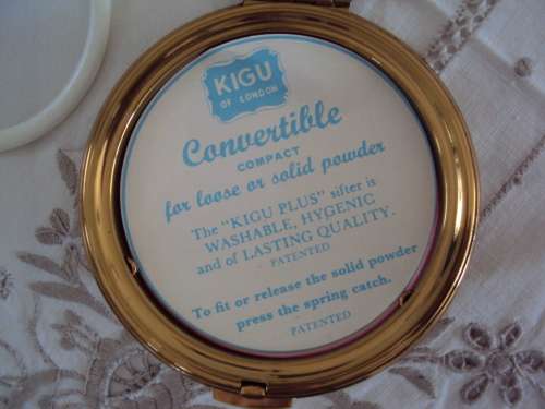 Vintage powder compact brown with gold tone accent, mirror intact.  UNUSED VGC