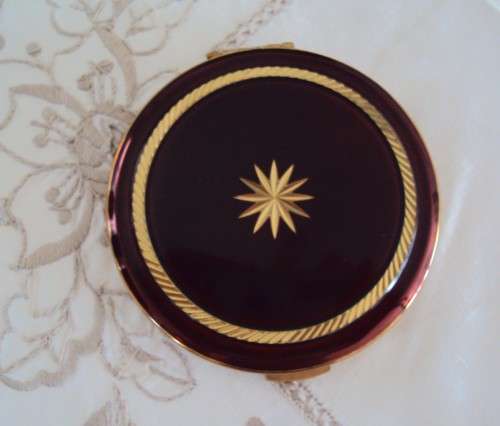 Vintage powder compact brown with gold tone accent, mirror intact.  UNUSED VGC