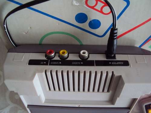 Vintage TV games console with 3 game cartridges - working