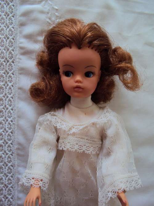 Vintage Hong Kong Sindy in white lace dress twist waist, bend legs,  tilting head 29cm tall