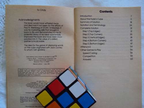 A Rubik's Cube plus a vintage book THE SIMPLE SOLUTION TO RUBIK'S CUBE