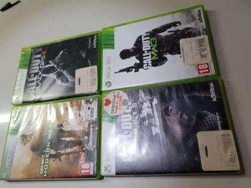 XBox 360 S 4gig, with 2 wireless remotes and 28 games