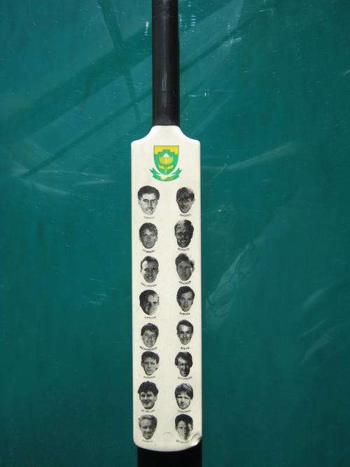 MINI BAT WITH PHOTOS OF SA PLAYERS INCLUDING, CRONJE, DONALD, DE VILLIERS, CULLINAN, MC MILLAN, etc.