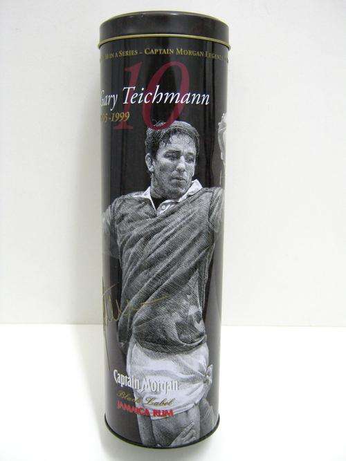 CAPTAIN MORGAN TIN WITH PHOTO & WRITE UP ON GARY TEICHMANN, GIVING HISTORY ETC ON HIM