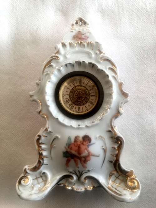 Ceramic clock with Putti