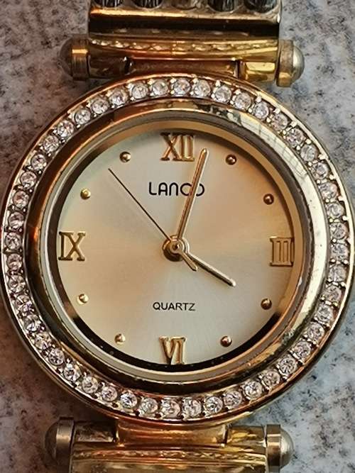 LADIES GOLD PLATED LANCO WATCH WITH CABLE STRAP IN EXCELLENT WORKING CONDITION VALUED @ R1200