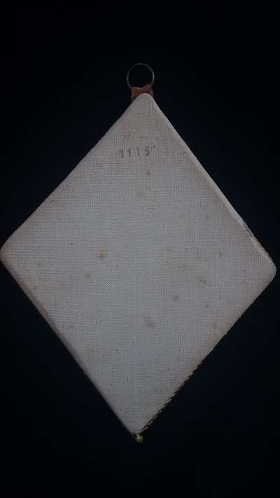 Silk printed picture in ornate gilt frame on velvet backing (numbered)