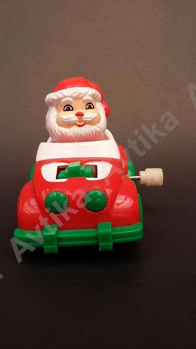 Cute little windup father christmas in his car - working