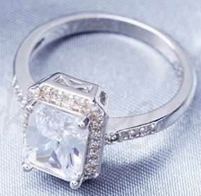 Incredible 3.79 Carat (TW) Radiant Cut Halo Ring. Size 7/O. Comes in gift box