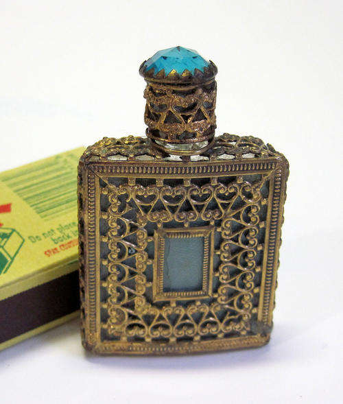 Small brass and glass perfume bottle