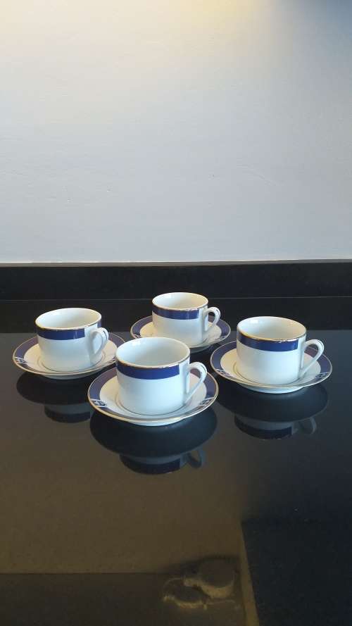 `TRISA R - Blue First` China set of 4 Demitasse cup and saucers - White, Cobalt blue with gold trim!