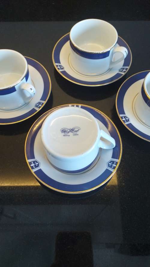 `TRISA R - Blue First` China set of 4 Demitasse cup and saucers - White, Cobalt blue with gold trim!