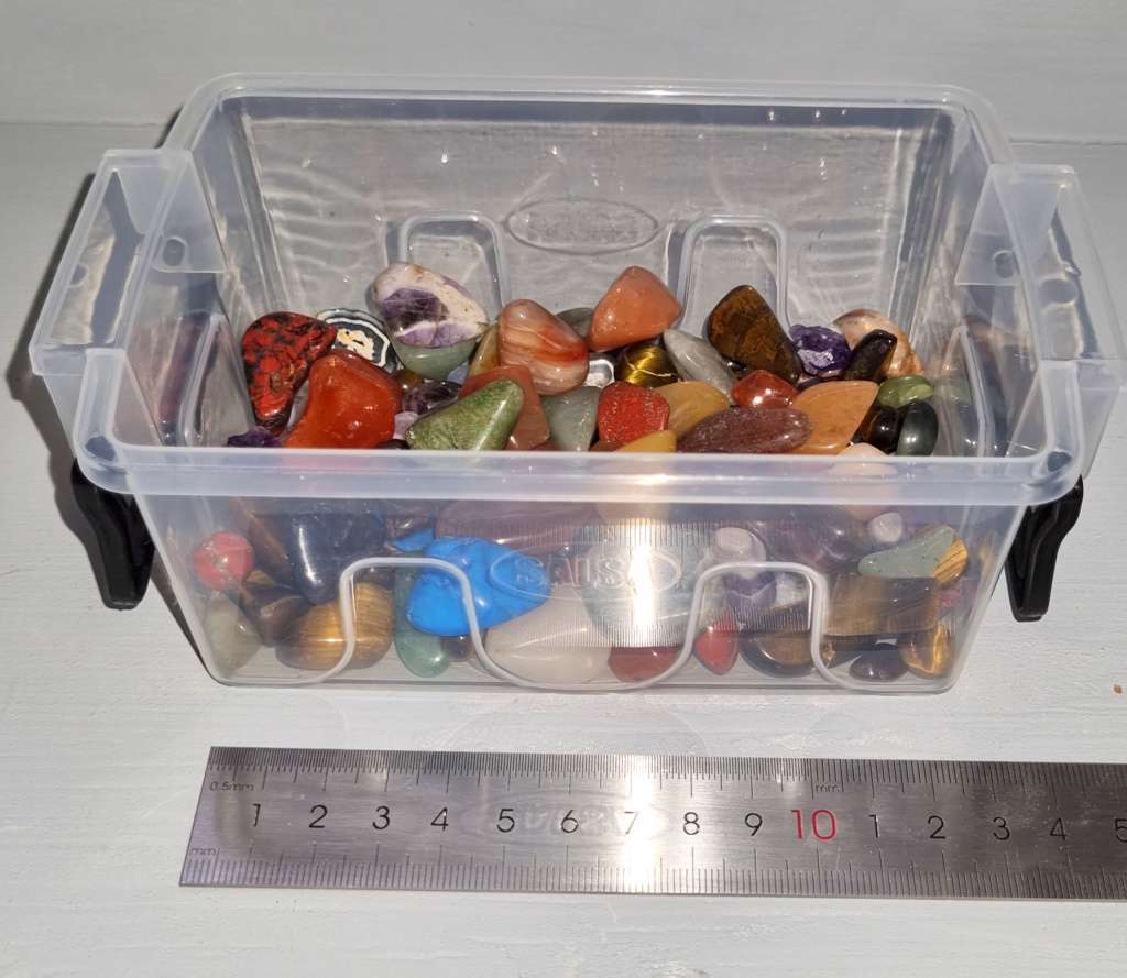 Collection of small tumbled stones ideal for jewelry making or crafting