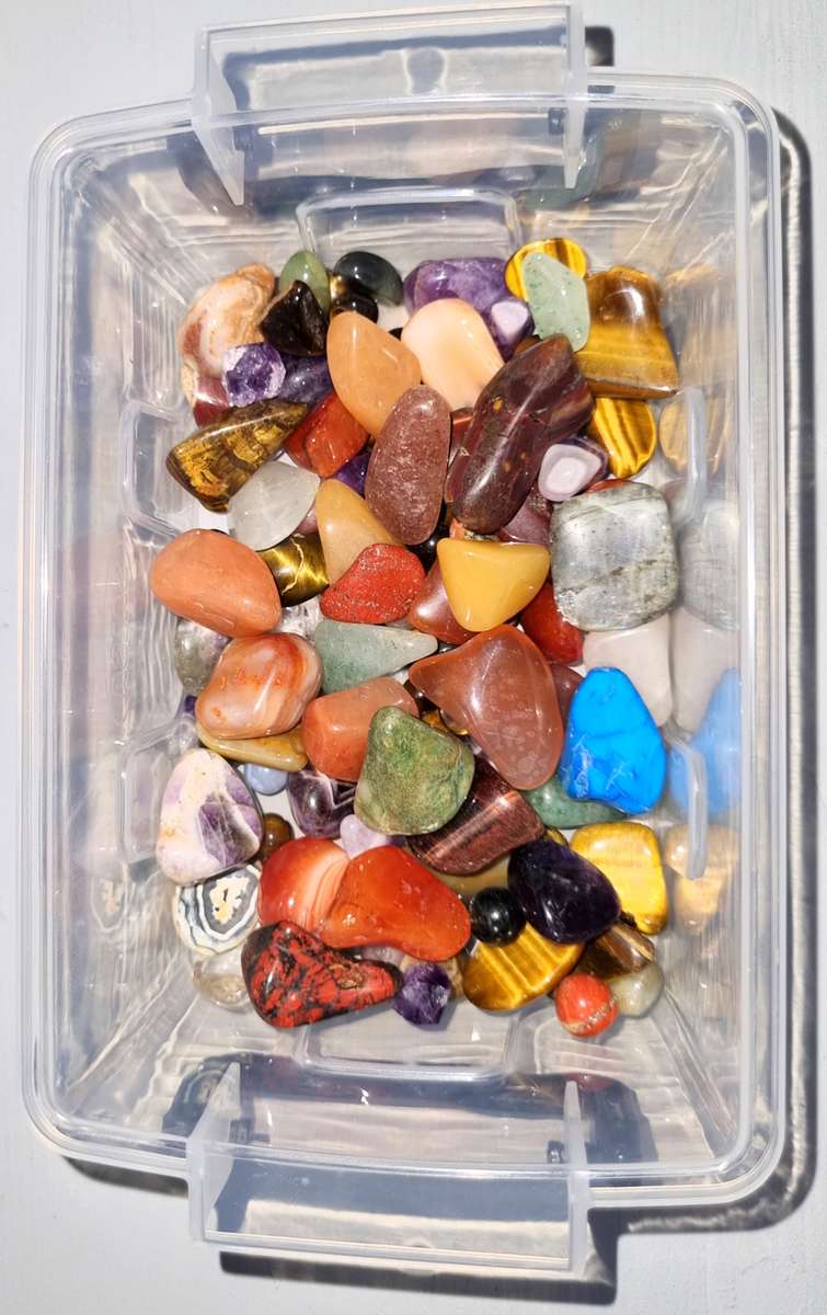 Collection of small tumbled stones ideal for jewelry making or crafting