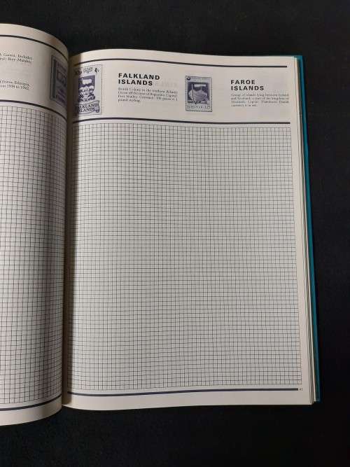 World Collector Stamp Album - Stanley Gibbons with some stamps