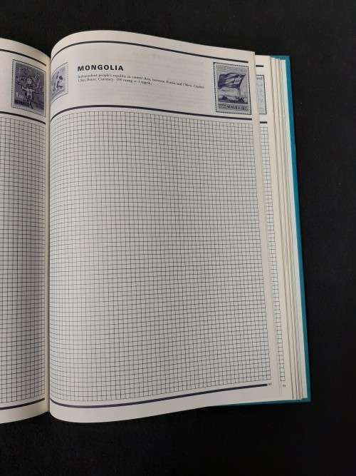 World Collector Stamp Album - Stanley Gibbons with some stamps