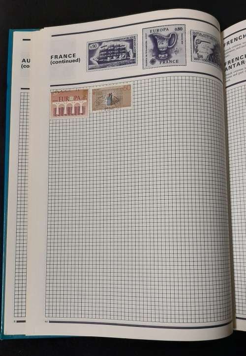 World Collector Stamp Album - Stanley Gibbons with some stamps