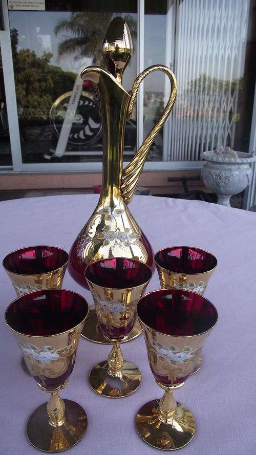 DEEP RED VENETIAN GLASS / GILDED AND HAND PAINTED DECANTER AND FIVE WINE GLASSES