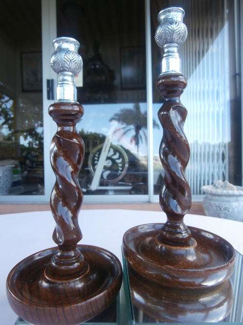CANDLE PAIR, ENGLISH OAK BARLEY TWIST DESIGN.  CAST METAL TOPS WITH EMBOSSED LEAF DECOR.  26CM TALL,