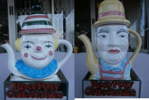TWO LOVELY PORCELAIN CLOWN TEA POTS IN MINT CONDITION. TO CUTE FOR WORDS