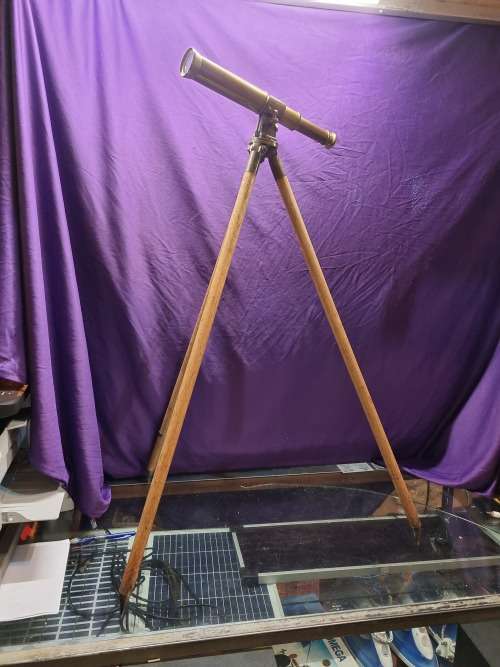 Brass telescope on wooden tripod