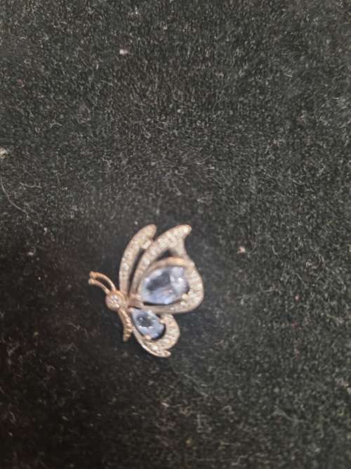 Assorted silver pendants and small silver charms