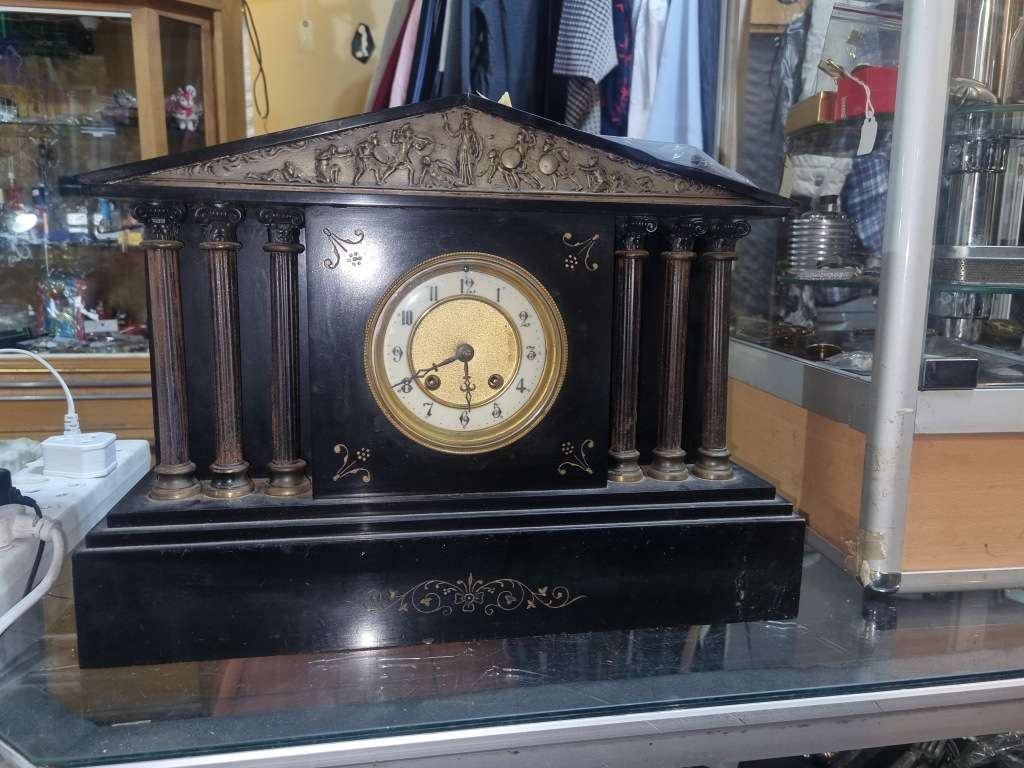 Marble mantle clock works just the chiming system not working  and some of those poles are loose
