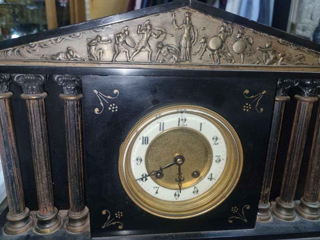 Marble mantle clock works just the chiming system not working  and some of those poles are loose