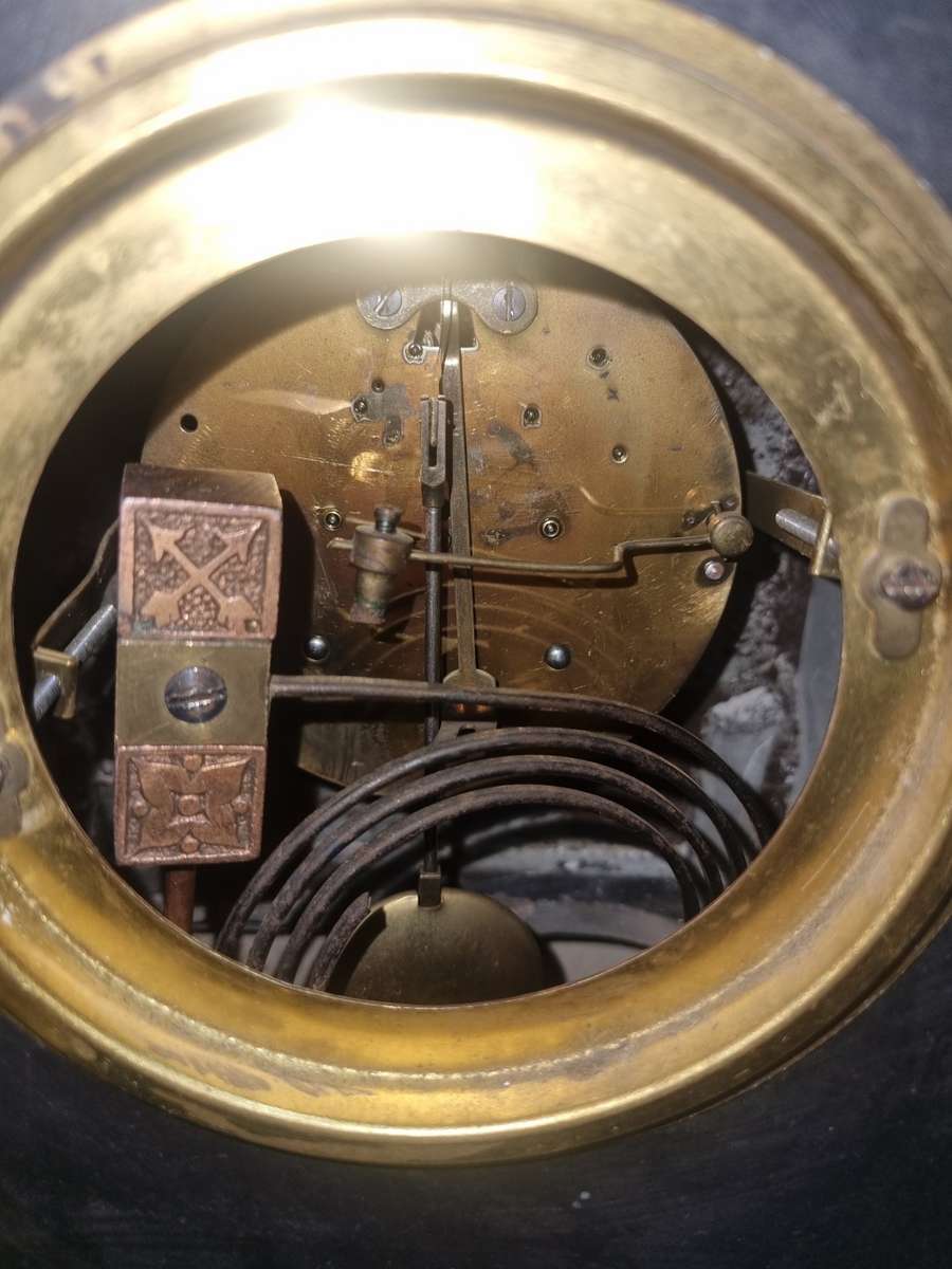 Marble mantle clock works just the chiming system not working  and some of those poles are loose