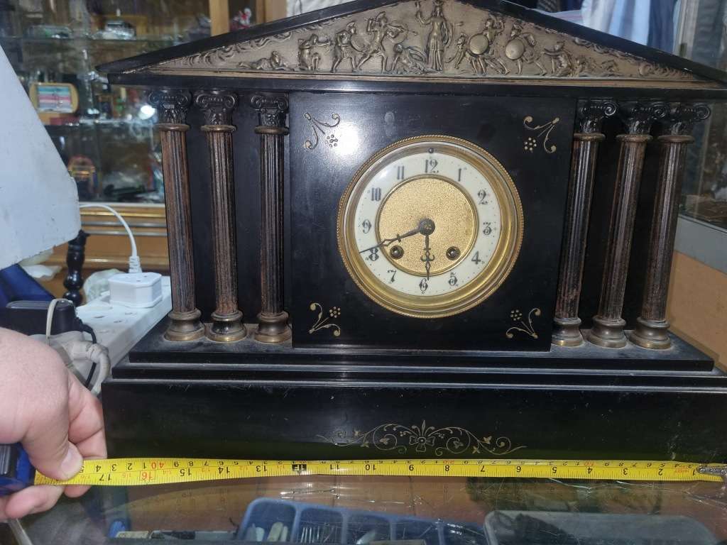 Marble mantle clock works just the chiming system not working  and some of those poles are loose