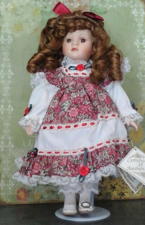 VINTAGE PORCELAIN DOLL