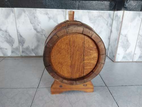 VINTAGE SOLID AND HEAVY OAK WINE BARREL WITH BRASS HOOPS ON A CUSTOM MADE STAND
