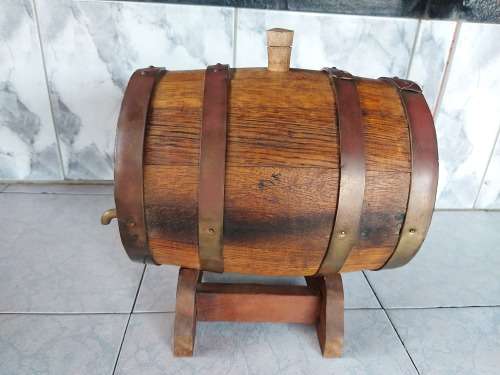 VINTAGE SOLID AND HEAVY OAK WINE BARREL WITH BRASS HOOPS ON A CUSTOM MADE STAND