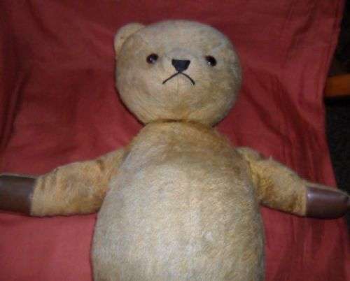 OLD STRAW FILLED TEDDY BEAR -JOINTED