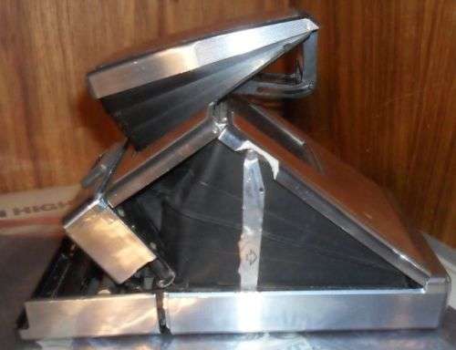 VINTAGE POLAROID SX-70 LAND CAMERA WITH SOME DAMAGE