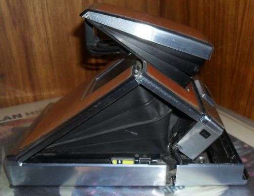 VINTAGE POLAROID SX-70 LAND CAMERA WITH SOME DAMAGE