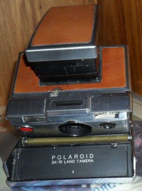 VINTAGE POLAROID SX-70 LAND CAMERA WITH SOME DAMAGE