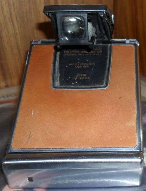 VINTAGE POLAROID SX-70 LAND CAMERA WITH SOME DAMAGE