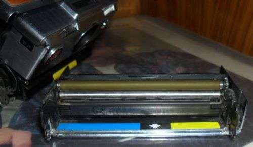 VINTAGE POLAROID SX-70 LAND CAMERA WITH SOME DAMAGE