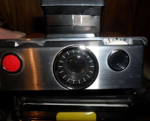 VINTAGE POLAROID SX-70 LAND CAMERA WITH SOME DAMAGE