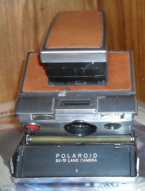 VINTAGE POLAROID SX-70 LAND CAMERA WITH SOME DAMAGE