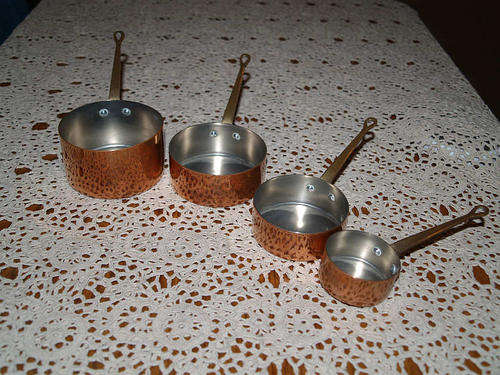 4 X COPPER AND BRASS MEASURING CUPS