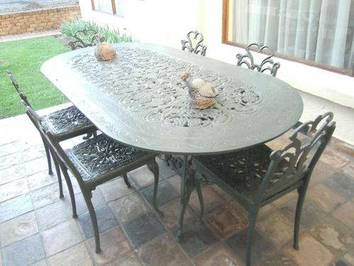 Solid Garden Set (six chairs) plus side table/serving table (cast iron?)