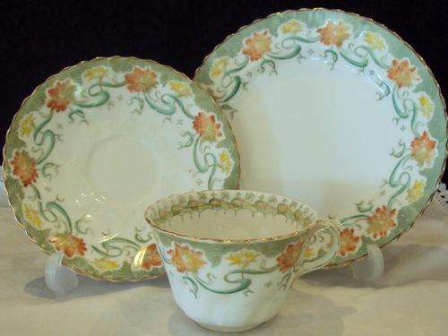 A HAND PAINTED EDWARDIAN TEA TRIO