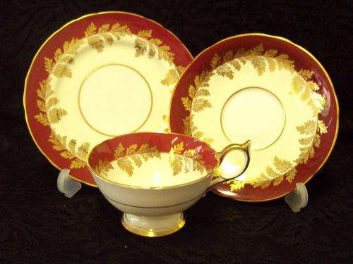 AN AYNSLEY TEA TRIO FOR CHINACRAFT