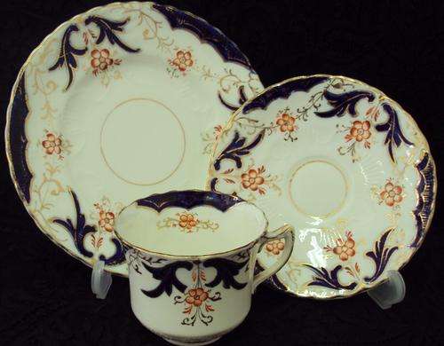 A MAGNIFICENT HANDPAINTED TEA TRIO